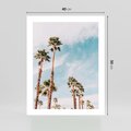 Plakat bez ramy 40x50 - Tropikalna Sielskość: Palmy i Błękitne Niebo - palmy na tle błękitnego nieba