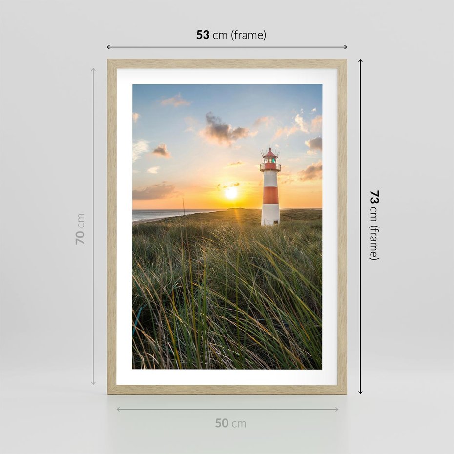 Plakat w ramie 50x70 - Magia latarni przy zachodzie - latarnia, zachód - rama drewno