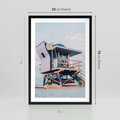 Plakat w ramie 50x70 - Plażowa Kolorystyka: Budka Ratownika w Pastelach - pastelowa budka ratownika, plaża Miami - rama czarna