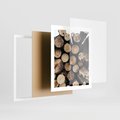 Plakat w ramie 40x50 - Siła Drewna - ścięte drewno, belki drewna ułożone jedna na drugiej - rama biała