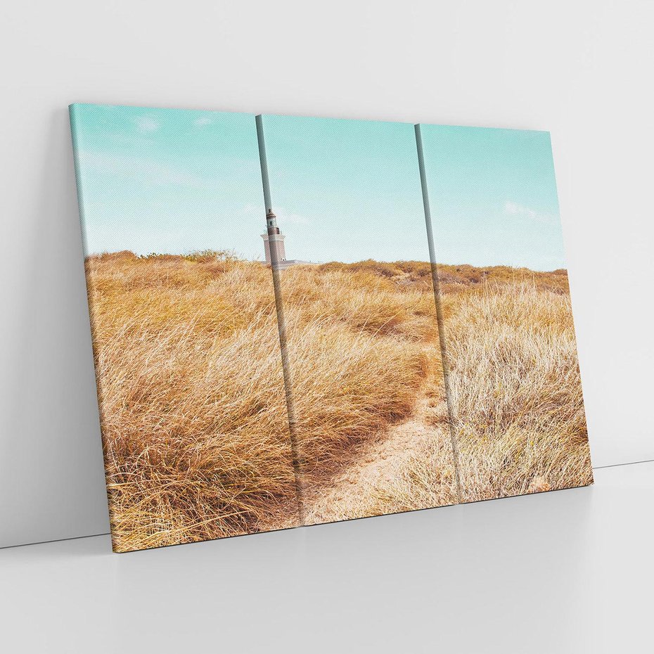 Obraz na płótnie 120x80 - Tajemnicza Ścieżka - latarnia morska w oddali, suche trawy