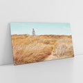 Obraz na płótnie 140x70 - Tajemnicza Ścieżka - latarnia morska w oddali, suche trawy