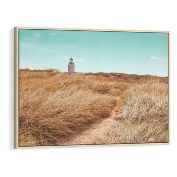 Obraz w ramie 70x50 - Tajemnicza Ścieżka - latarnia morska w oddali, suche trawy - rama drewno