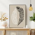 Obraz w ramie 70x100 - Spleciona Harmonia - sztuka nowoczesna, białe i czarne pióro - rama czarna