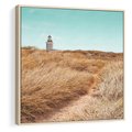 Obraz w ramie 50x50 - Tajemnicza Ścieżka - latarnia morska w oddali, suche trawy - rama drewno