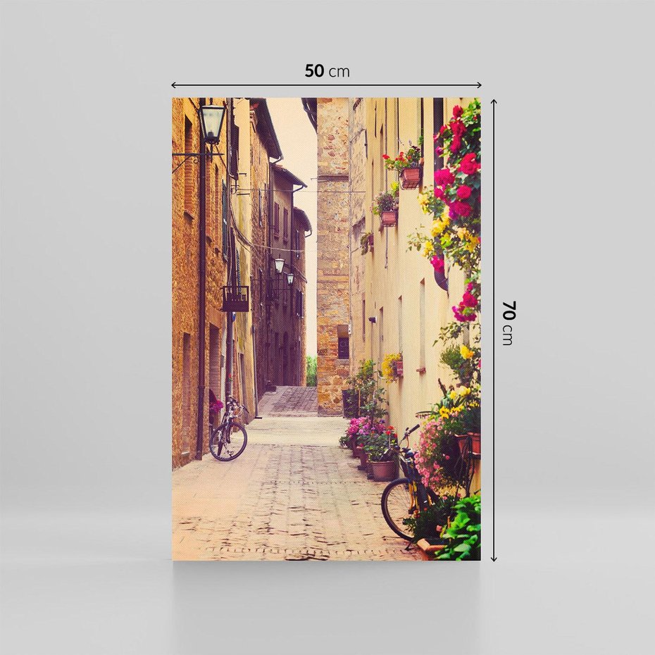 Obraz na płótnie 50x70 - Rowerowa przygoda w uliczkach pełnych perspektywy - uliczka, perspektywa