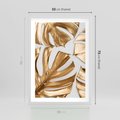 Plakat w ramie 50x70 - Złote Akcenty w Fotografii - złotel liście monstery, na białym tle - rama biała