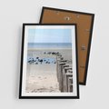 Plakat w ramie 50x70 - Fale na falochronie nad morzem - morze, falochron - rama czarna