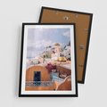 Plakat w ramie 50x70 - Błękit Morza i Białe Domki - Santorini, wyspa - rama czarna
