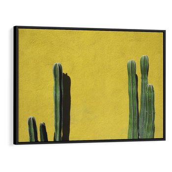 Obraz w ramie 100x70 - Refleksje w roślinnym odbiciu - zielone kaktusy na tle żółtej ściany, soczyste kolory - rama czarna