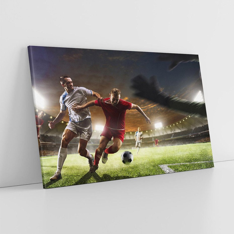 Obraz na płótnie 100x70 - Piłkarska pasja - piłkarz, stadion