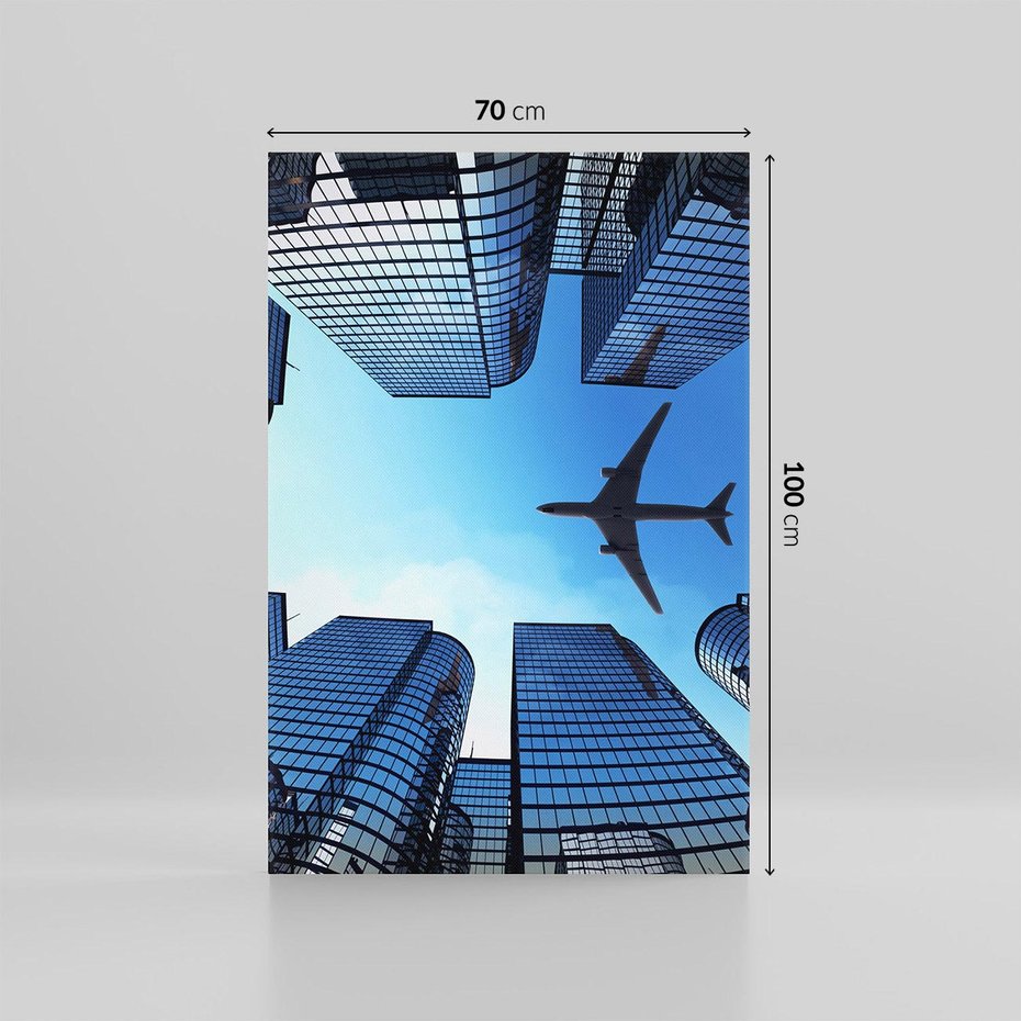 Obraz na płótnie 70x100 - Miasto o niezwykłym widoku - latające samoloty - miasto, samolot