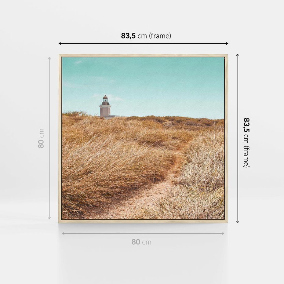 Obraz w ramie 80x80 - Tajemnicza Ścieżka - latarnia morska w oddali, suche trawy - rama drewno