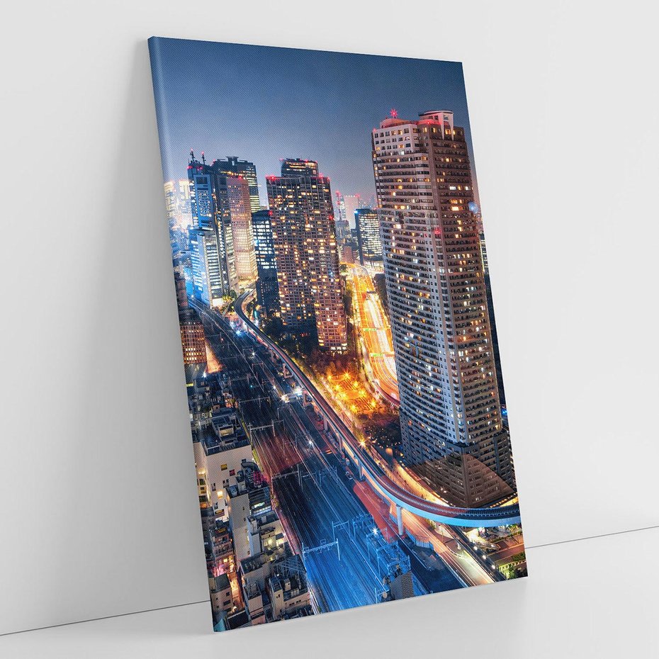 Obraz na płótnie 70x100 - Miasto nocą z wieżowcami w tle - miasto, nocą