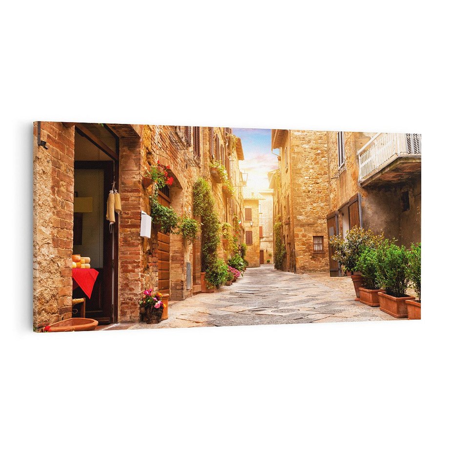 Obraz na płótnie 100x50 - Urok uliczki miejskiej z kwiatami - sklep, uliczka
