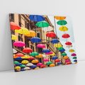 Obraz na płótnie 120x80 - Barwna symfonia wyobraźni - fotografia, kolorowe parasolki podwieszone nad ulicą