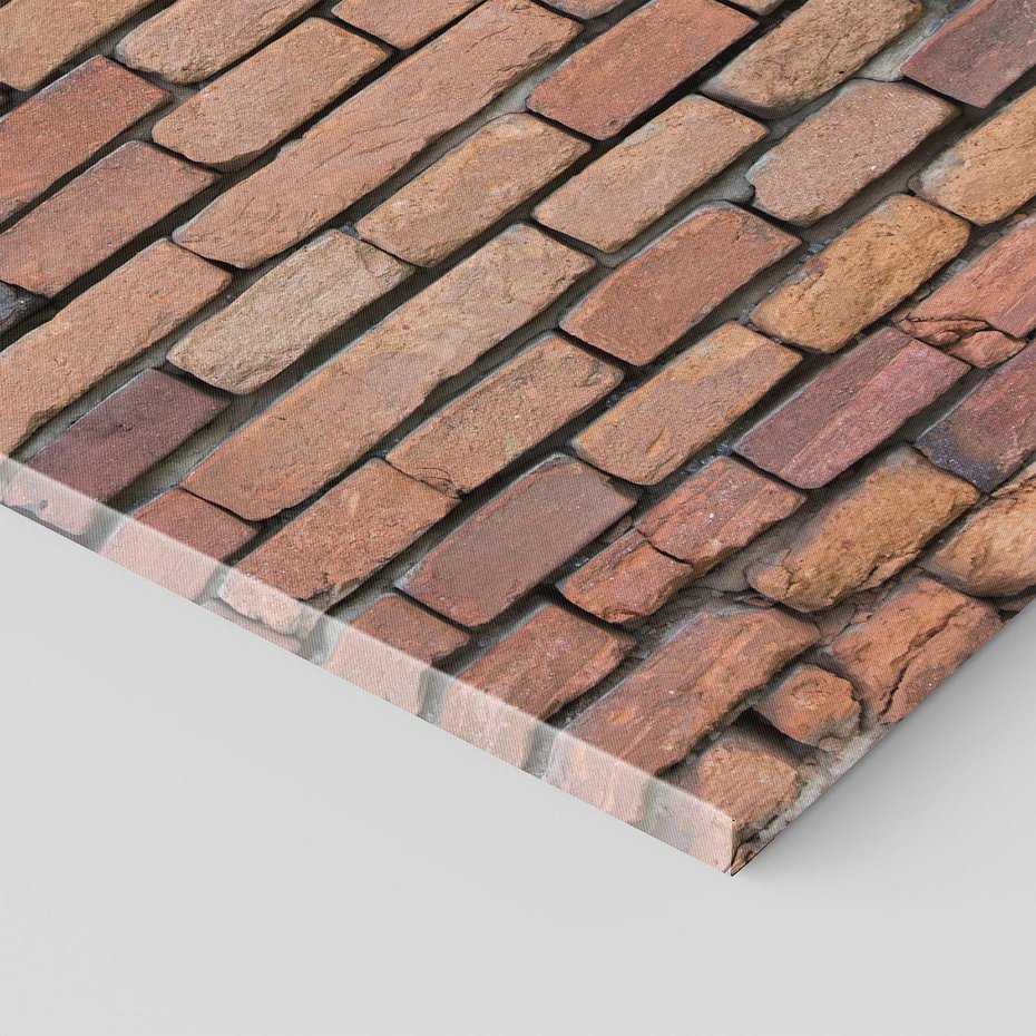 Obraz na płótnie 70x100 - Mur cegieł: industrialny urok - cegły, mur