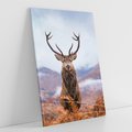 Obraz na płótnie 70x100 - Jeleń w Uśpionym Krajobrazie - jeleń na tle gór, ośnieżone góry