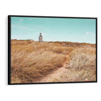 Obraz w ramie 70x50 - Tajemnicza Ścieżka - latarnia morska w oddali, suche trawy - rama czarna
