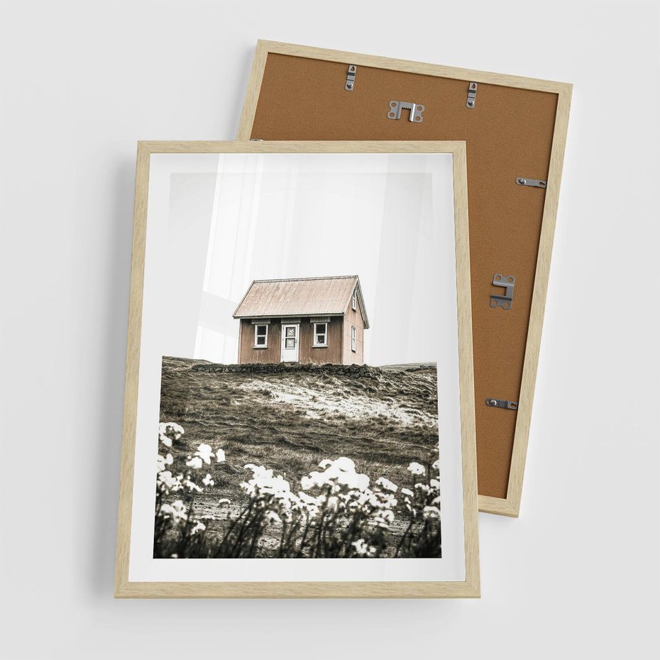 Plakat w ramie 50x70 - Krajobraz z Przeszłości: Kwitnąca Łąka w Sepii - domek na wzgórzu, kwitnąca łąka - rama drewno