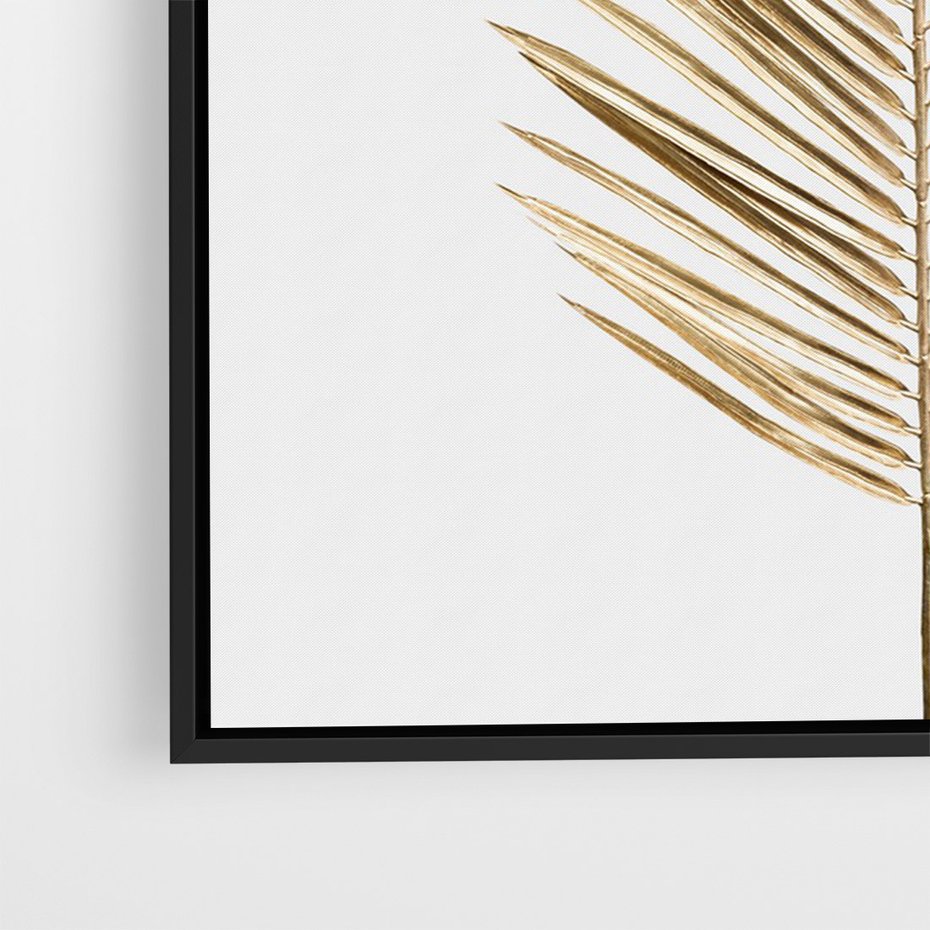 Obraz w ramie 70x100 - Złoty blask palmowego liścia - złota, palma - rama czarna