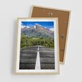 Plakat w ramie 50x70 - Droga przez góry: podróż do przygody - droga, góry - rama drewno