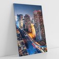 Obraz na płótnie 50x70 - Miasto nocą z wieżowcami w tle - miasto, nocą