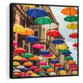 Obraz w ramie 50x50 - Barwna symfonia wyobraźni - fotografia, kolorowe parasolki podwieszone nad ulicą - rama czarna