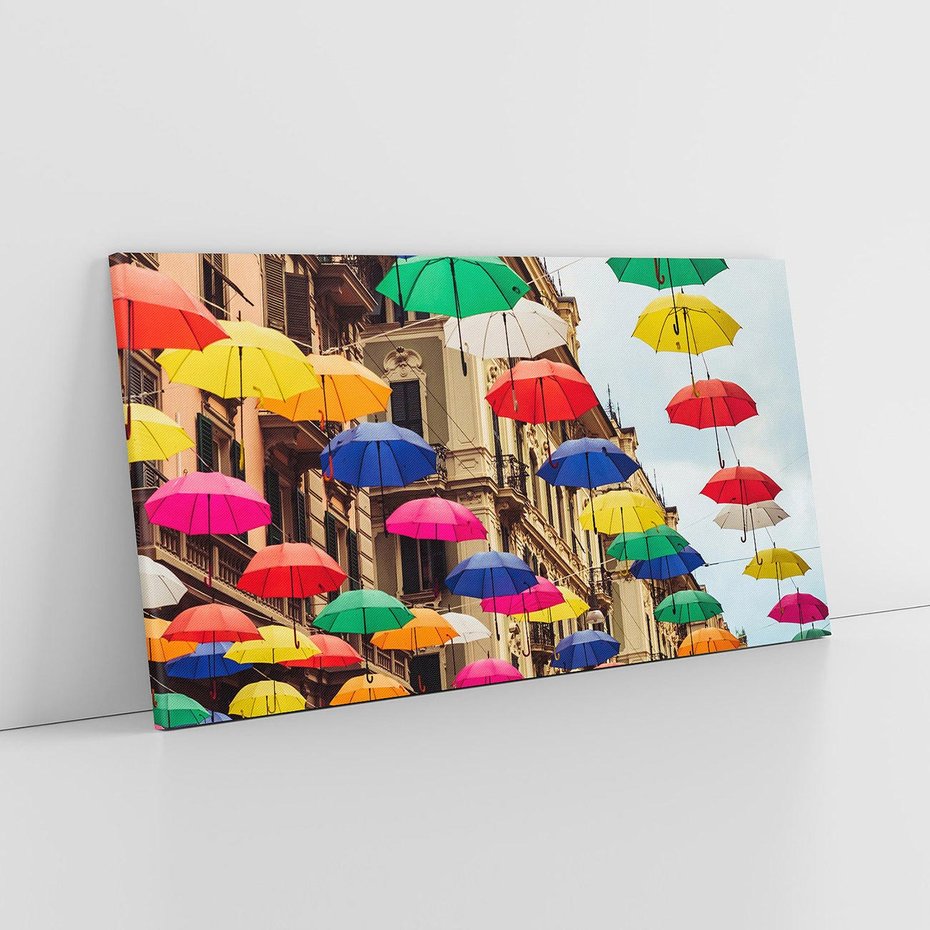 Obraz na płótnie 120x60 - Barwna symfonia wyobraźni - fotografia, kolorowe parasolki podwieszone nad ulicą