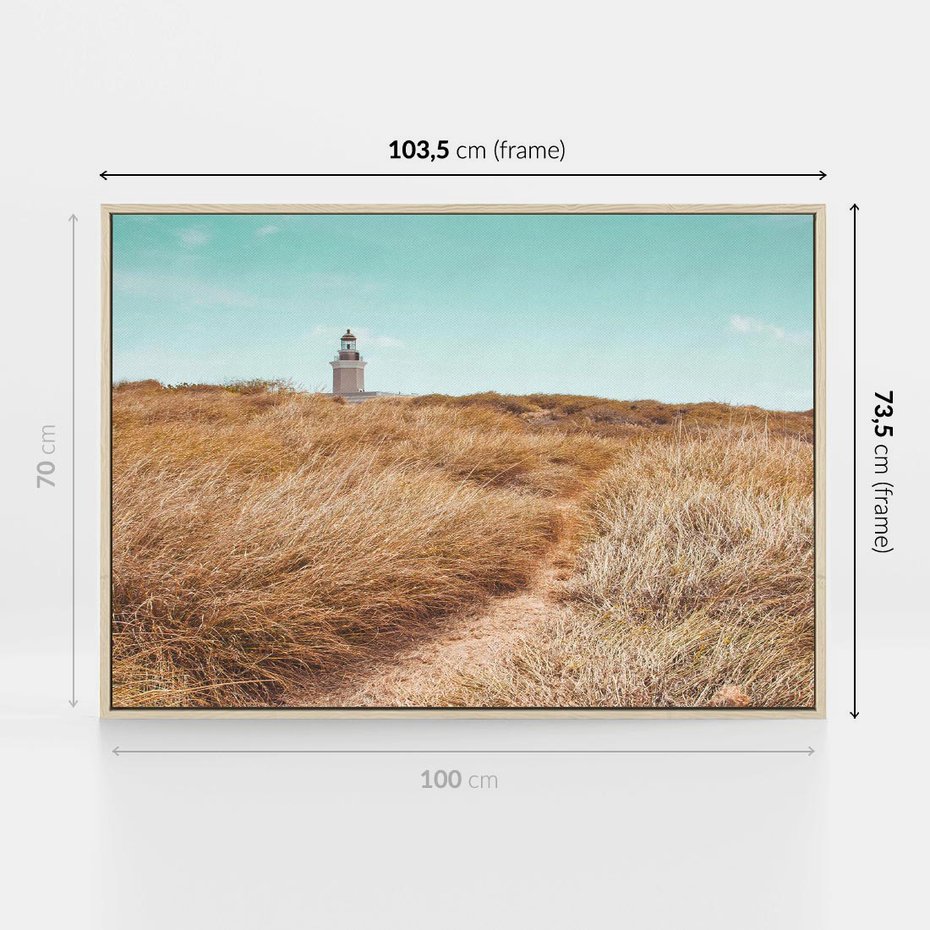 Obraz w ramie 100x70 - Tajemnicza Ścieżka - latarnia morska w oddali, suche trawy - rama drewno