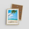 Plakat w ramie 30x40 - Hawajska palma i huśtawka na plaży - palma, huśtawka - rama drewno