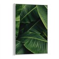 Obraz w ramie 80x120 - Zaklęta roślinna ekspresja - liście bananowca, gęsto ułożone - rama biała