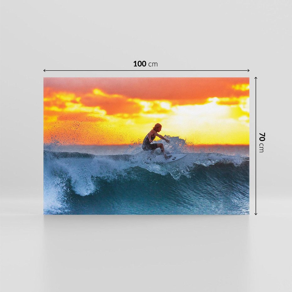 Obraz na płótnie 100x70 - Surfer na falach morza: Spotkanie z wolnością - surfer, surfing