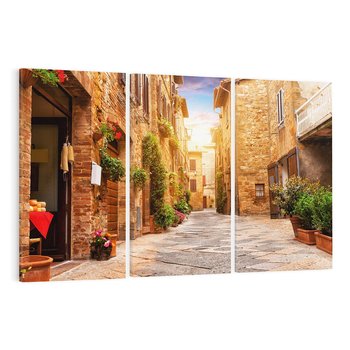 Obraz na płótnie 120x80 - Urok uliczki miejskiej z kwiatami - sklep, uliczka