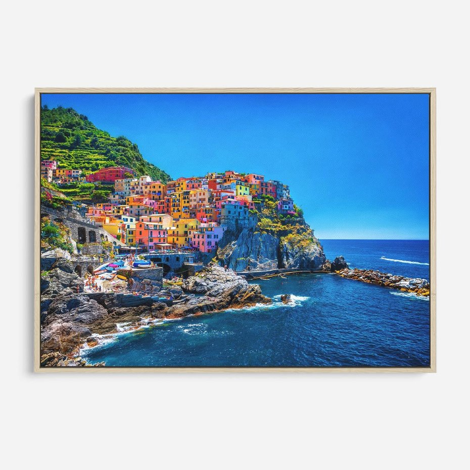 Obraz w ramie 100x70 - Barwne Wybrzeże - nadmorskie miasto na klifie, kolorowe tęczowe budynki - rama drewno