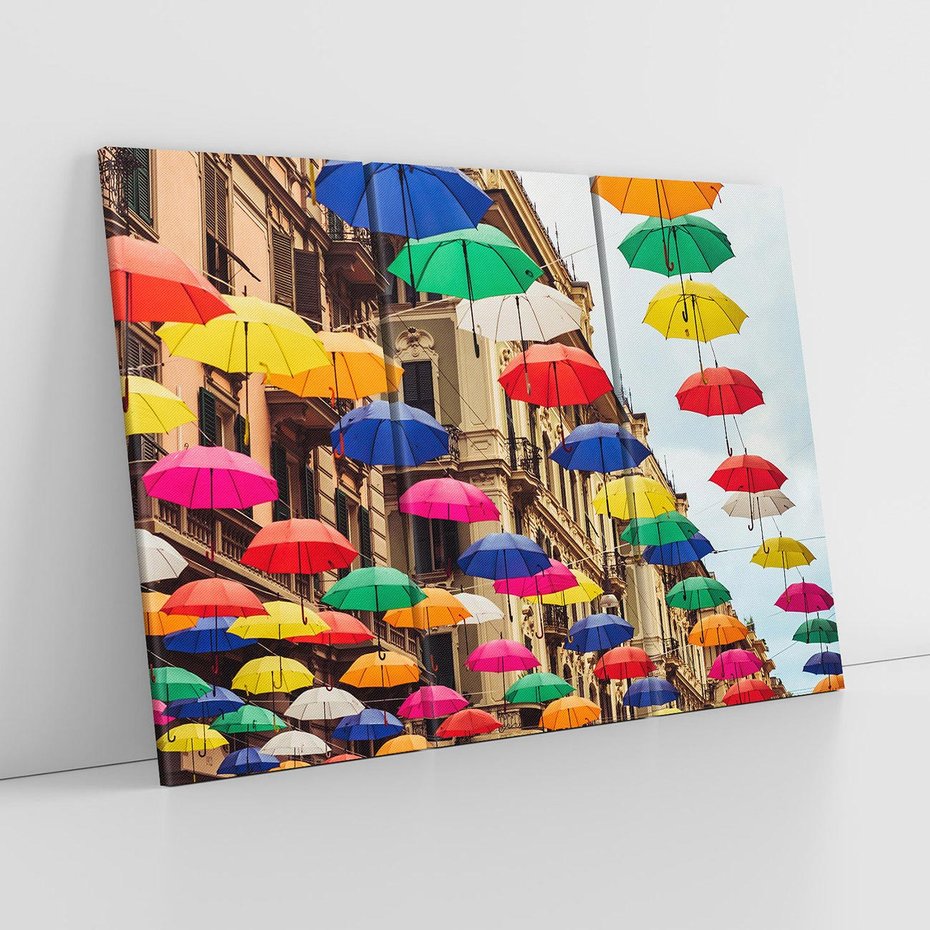 Obraz na płótnie 120x80 - Barwna symfonia wyobraźni - fotografia, kolorowe parasolki podwieszone nad ulicą