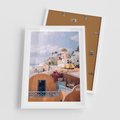Plakat w ramie 50x70 - Błękit Morza i Białe Domki - Santorini, wyspa - rama biała
