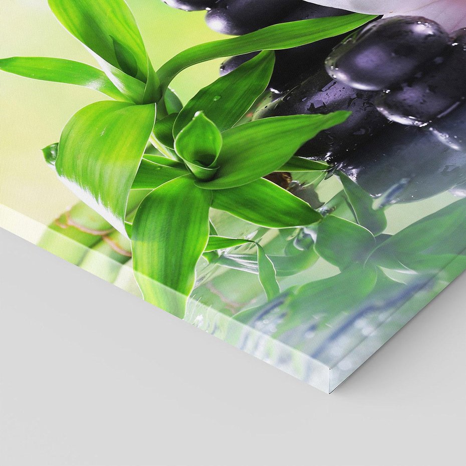 Obraz na płótnie 100x70 - Oaza Spokoju: Bambus, Kwiaty i Kamienie w SPA - bambus, kwiat