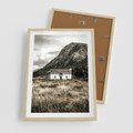 Plakat w ramie 50x70 - Biały Domek w Sepii: Wiejski Urok - domek w górach, kolory sepii - rama drewno