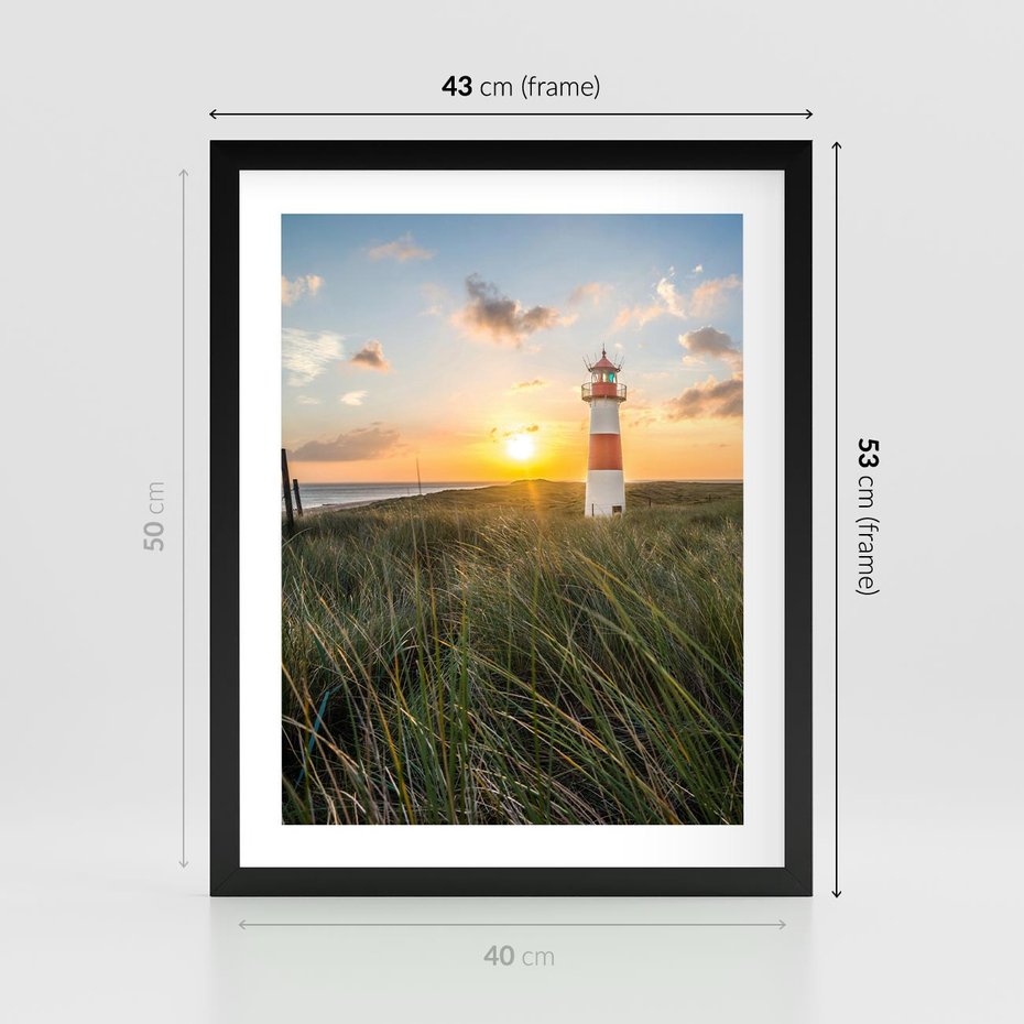 Plakat w ramie 40x50 - Magia latarni przy zachodzie - latarnia, zachód - rama czarna