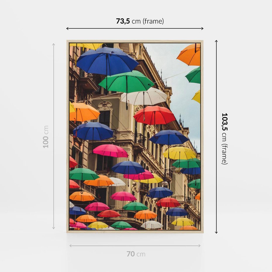 Obraz w ramie 70x100 - Barwna symfonia wyobraźni - fotografia, kolorowe parasolki podwieszone nad ulicą - rama drewno