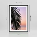Plakat w ramie 50x70 - Liście Palmy nad Morzem - zachód słońca, liście palmy na tle nieba i morza - rama czarna