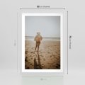 Plakat w ramie 50x70 - O Zachodzie Słońca - klimatyczna fotografia, postać biegnie po plaży - rama biała