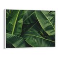 Obraz w ramie 120x80 - Zaklęta roślinna ekspresja - liście bananowca, gęsto ułożone - rama biała