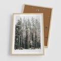 Plakat w ramie 50x70 - Sypiący Śnieg - las w zimie, drzewa pod śniegiem - rama drewno