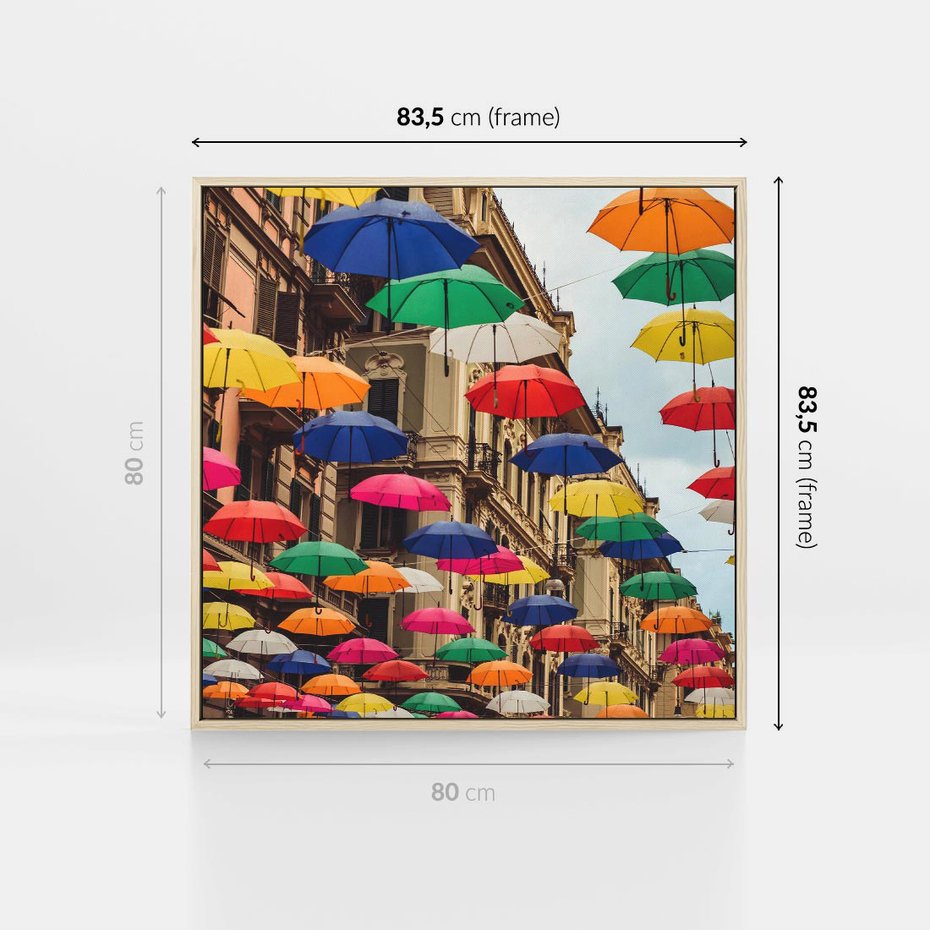 Obraz w ramie 80x80 - Barwna symfonia wyobraźni - fotografia, kolorowe parasolki podwieszone nad ulicą - rama drewno