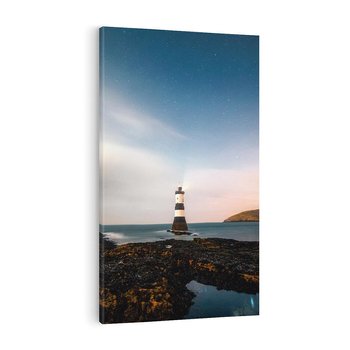 Obraz na płótnie 70x100 - Zachód słońca nad morzem: Magia plażowej scenerii - latarnia morska, morze