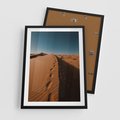 Plakat w ramie 50x70 - Piasek pustyni w ogniu - pustynia, piasek - rama czarna