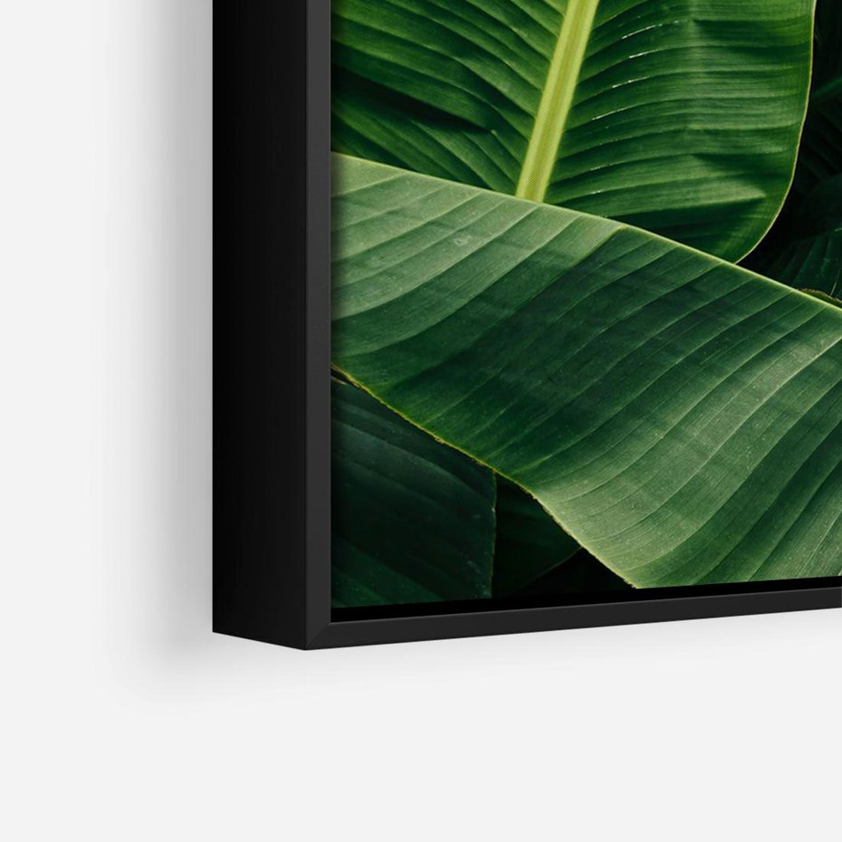 Obraz w ramie 100x70 - Zaklęta roślinna ekspresja - liście bananowca, gęsto ułożone - rama czarna