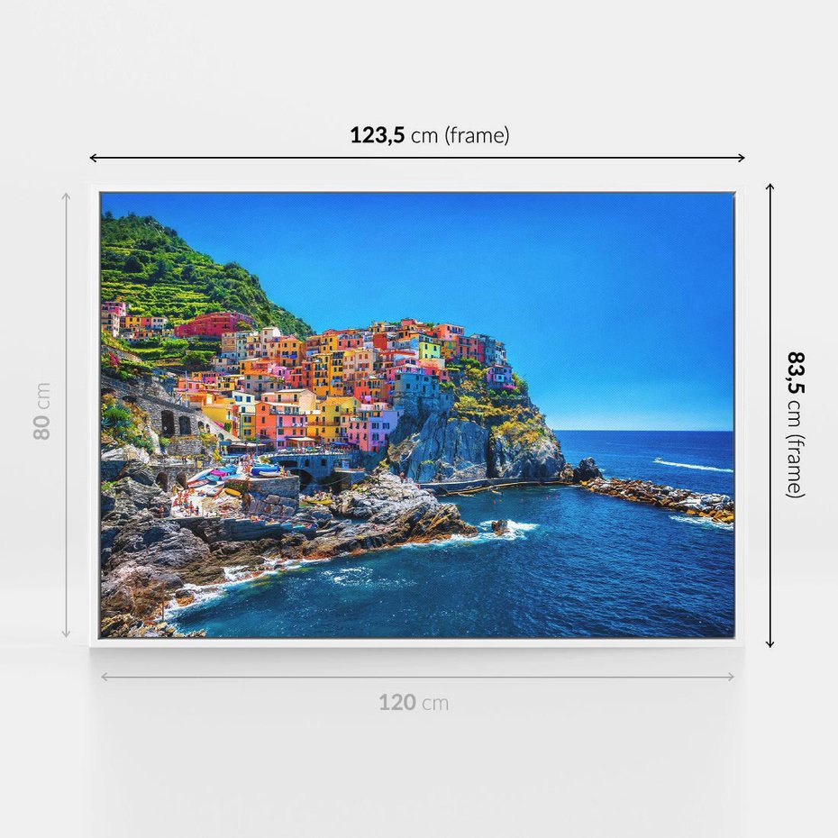 Obraz w ramie 120x80 - Barwne Wybrzeże - nadmorskie miasto na klifie, kolorowe tęczowe budynki - rama biała